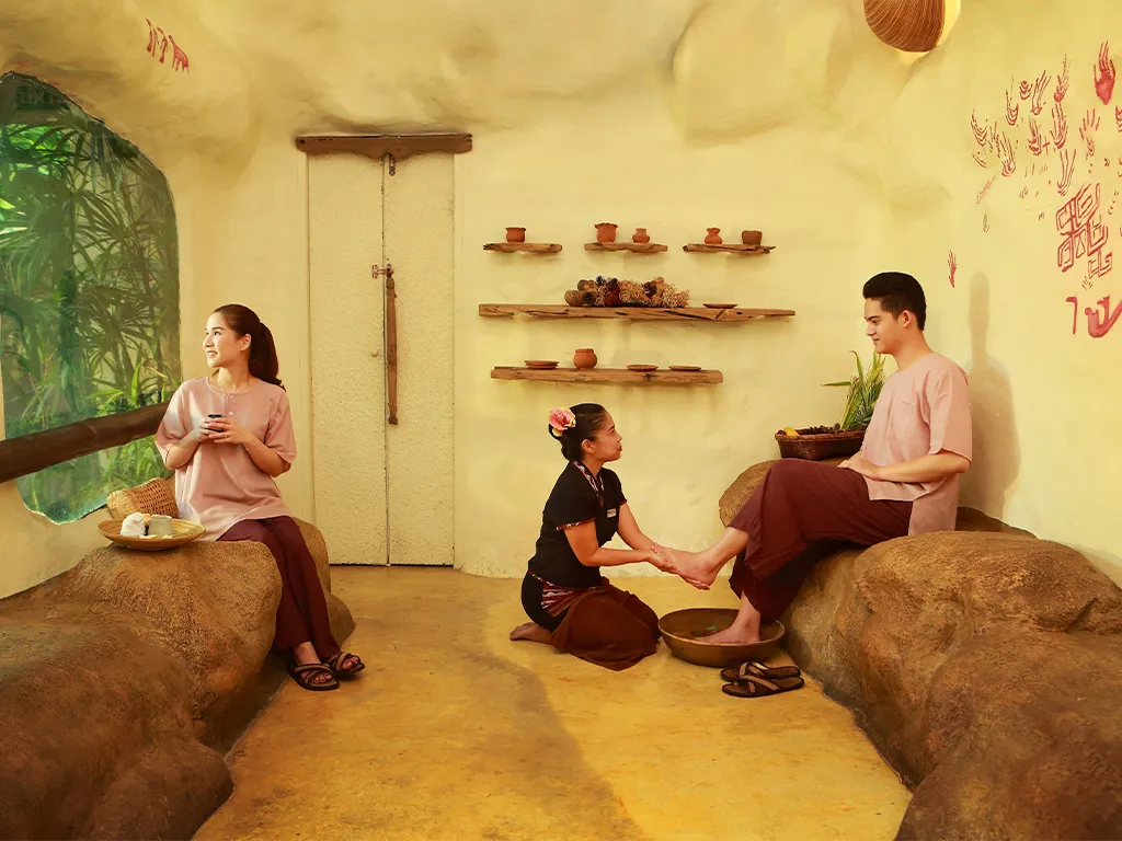 Guest enjoying traditional herbal tea after a relaxing spa treatment at Srimantra Spa Chiang Mai