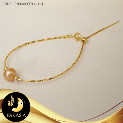 สร้อยข้อมือมุกเม็ดเดี่ยว คั่นล็อคบอลซิลิโคนคู่ มุก South Sea สีทองเข้ม Deep Gold ทรง Semi-round ขนาด 10 mm เกรด AA สร้อยหัวเข็มและล็อคบอลเงินแท้ 92.5 ชุบทอง / B462