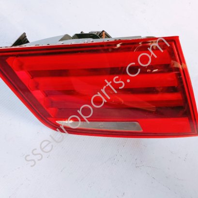 Rear light in trunk lid, left 63217203225 7203225