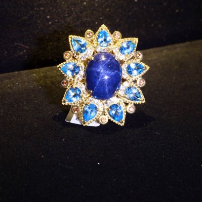 &quot;Tanusorn Natural Star Sapphire 22 carat Ring Adorned with Blue Topaz Gemstone&quot;