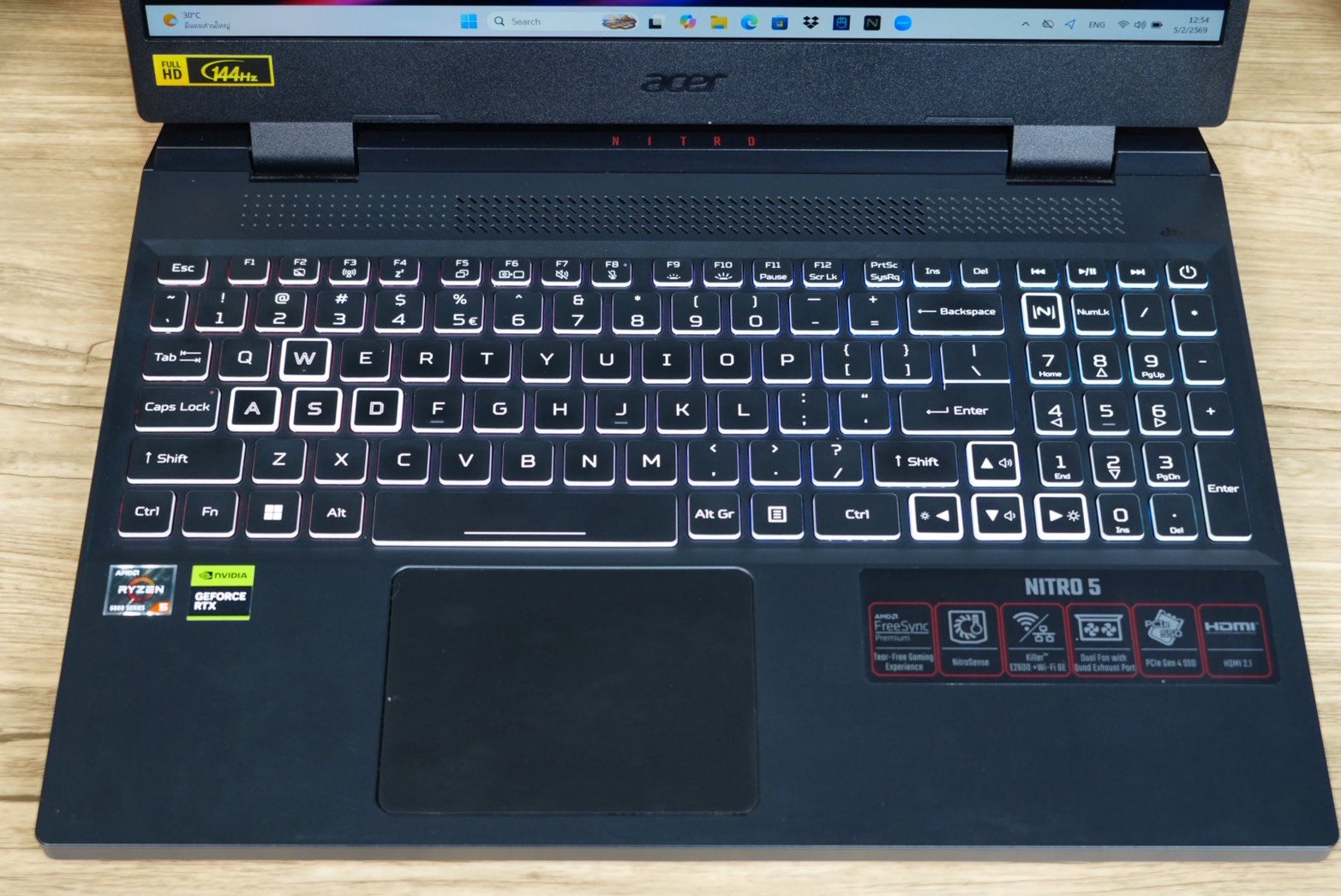 PC setup for Minecraft troubleshooting Gaming laptop keyboard and touchpad on a desk