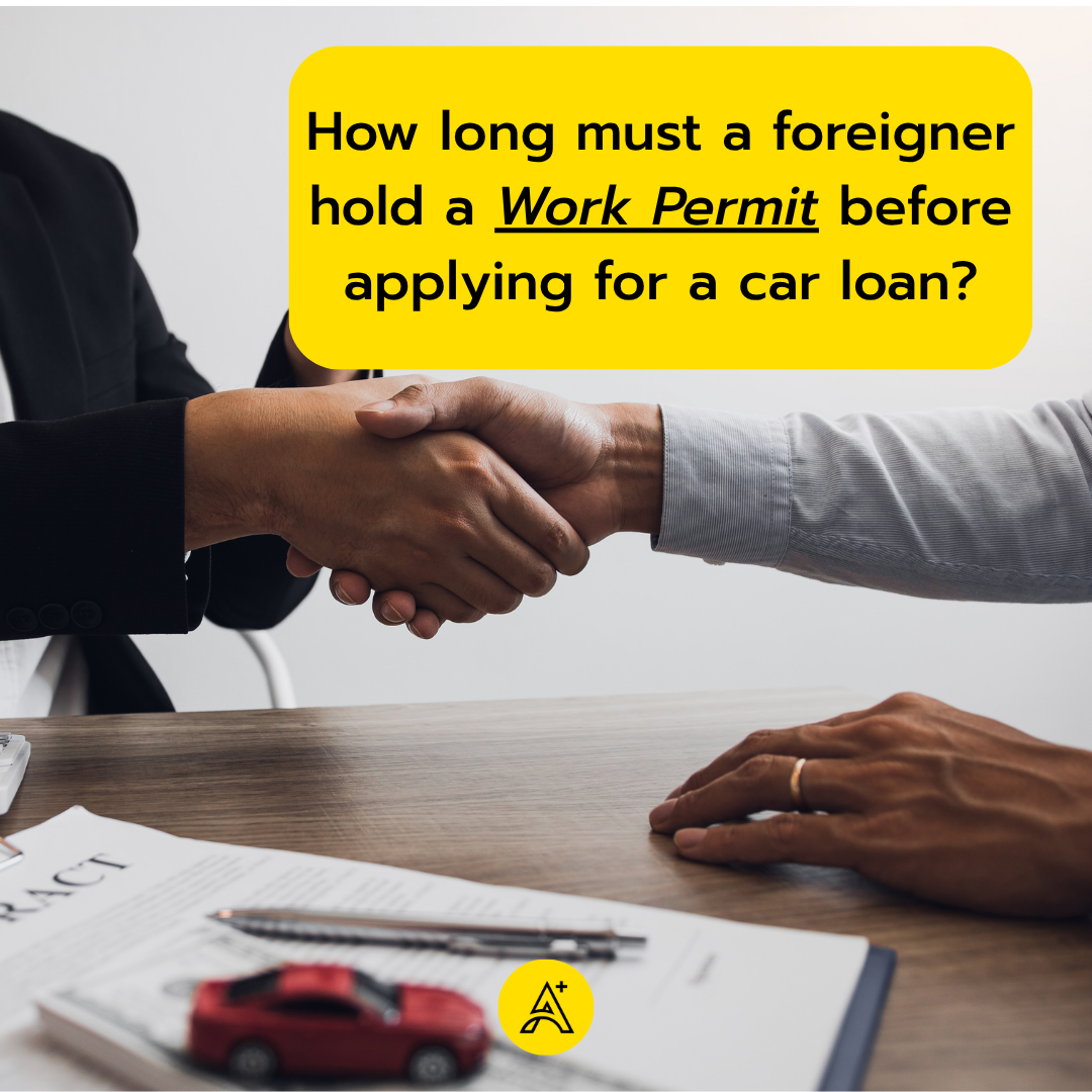 How long must a foreigner hold a Work Permit before applying for a car loan?