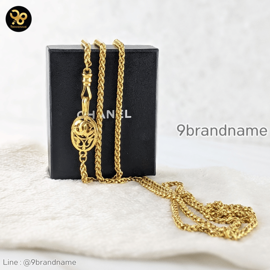 Chanel Chanel gold braid necklace with CC fob. Measures 78″ total.