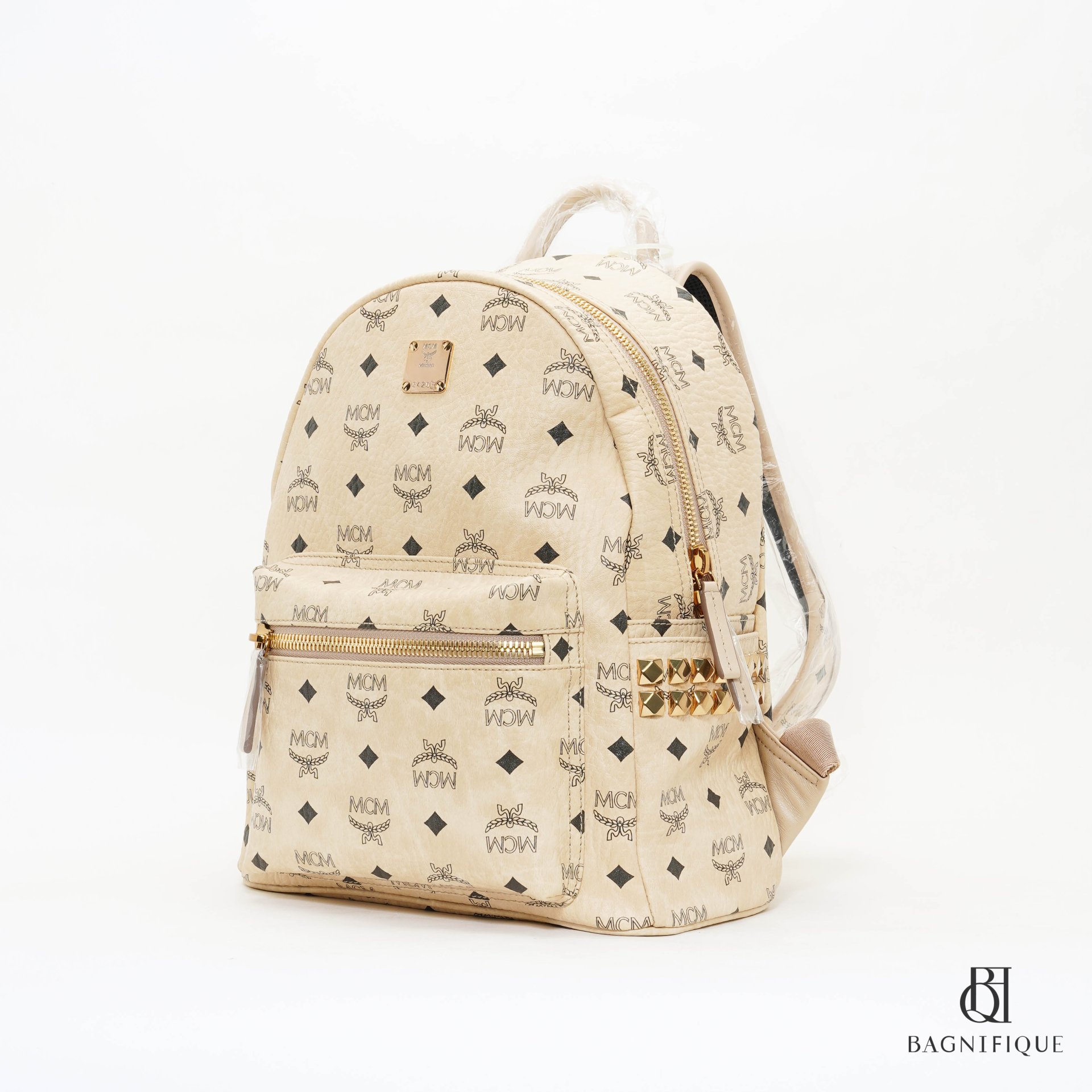 Cream mcm online backpack