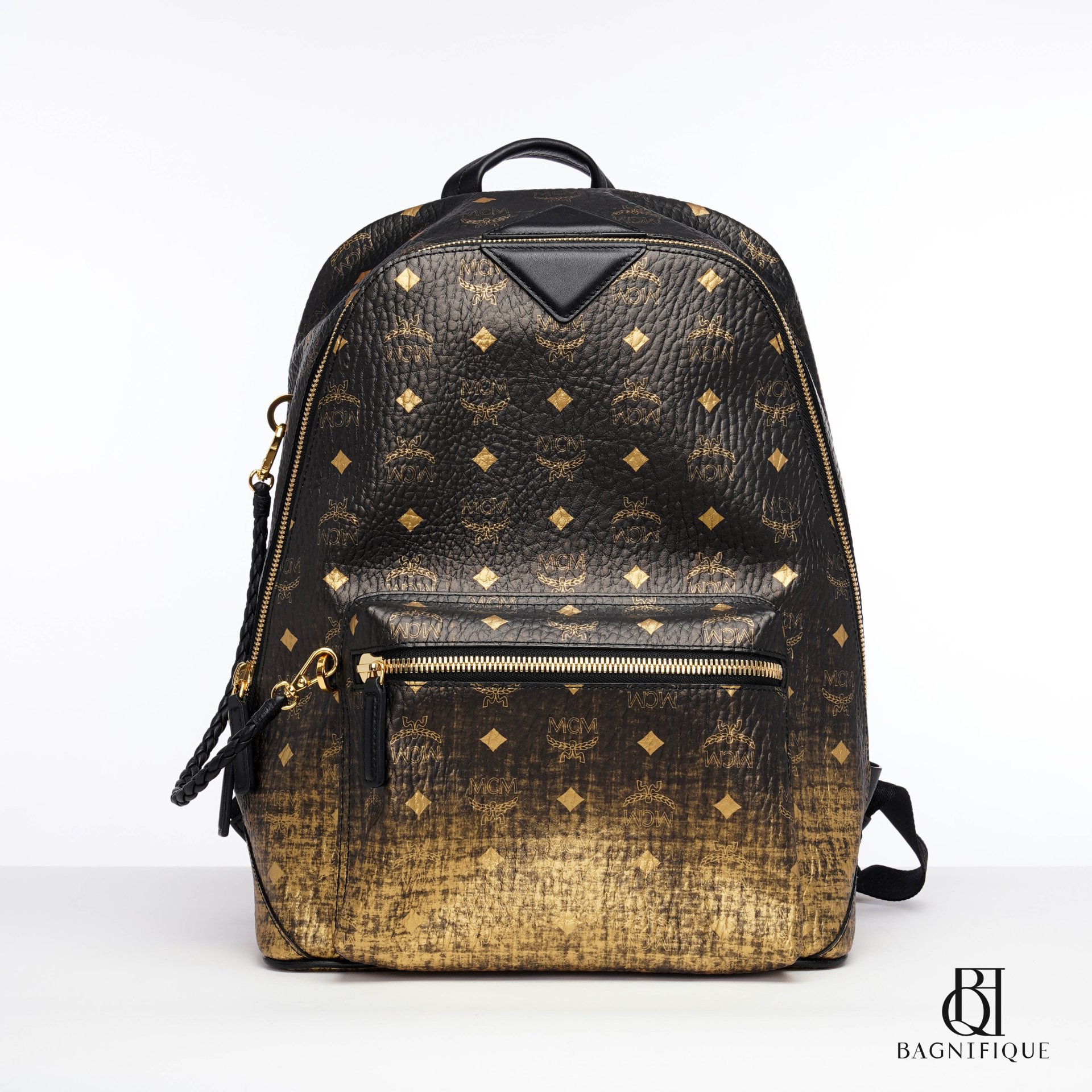 Mcm black store and gold backpack