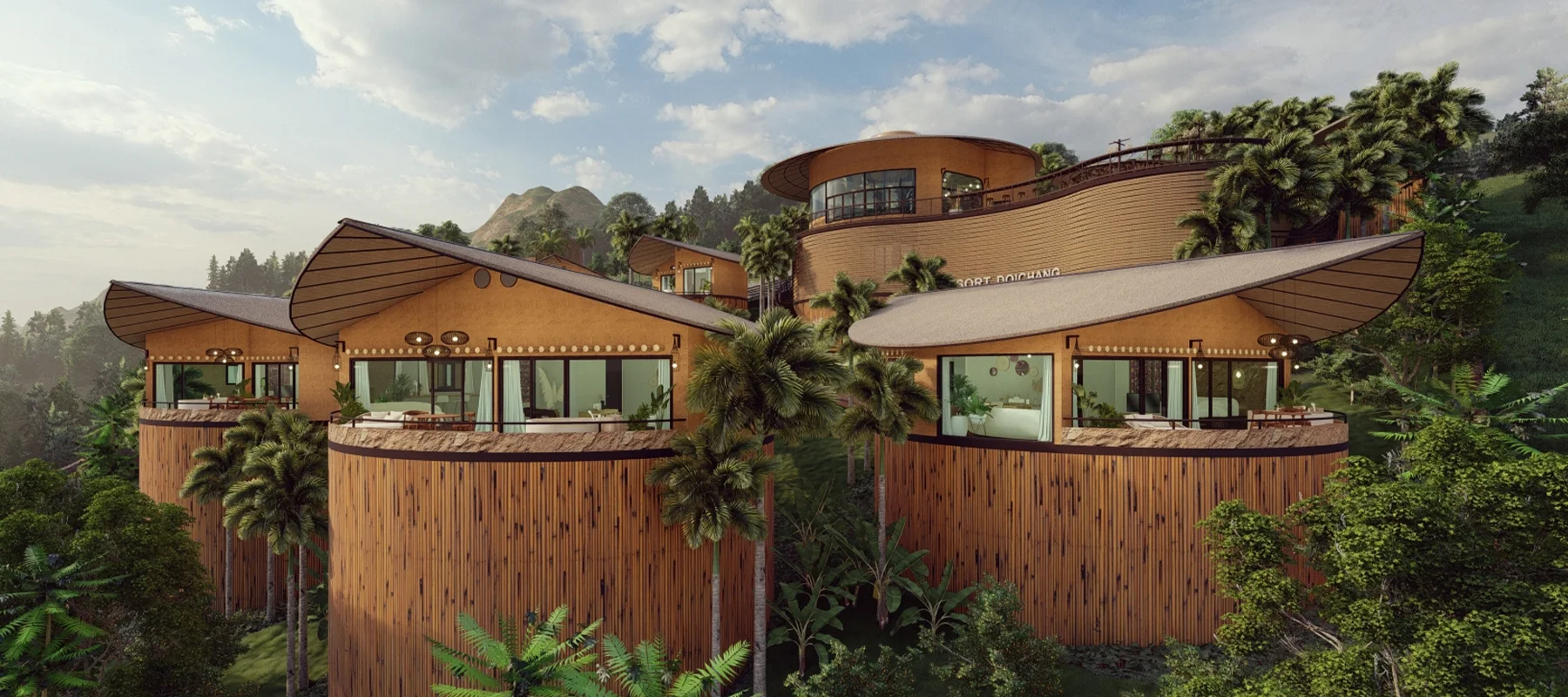 สถาปัตยกรรมรีสอร์ทหรูสไตล์ธรรมชาติ ตั้งอยู่บนเนินเขา รายล้อมด้วยป่าเขตร้อน อาคารทรงปีกนก ผนังไม้ไผ่ และกระจกบานใหญ่รับวิวธรรมชาติ