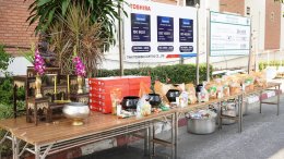 Management and employees of Thai Toshiba Lighting Co., Ltd. participated in a merit-making ceremony by offering alms to Buddhist monks and performing the traditional water-pouring ritual over a Buddha image in celebration of the Songkran Festival, seeking