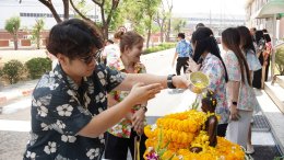 Management and employees of Thai Toshiba Lighting Co., Ltd. participated in a merit-making ceremony by offering alms to Buddhist monks and performing the traditional water-pouring ritual over a Buddha image in celebration of the Songkran Festival, seeking