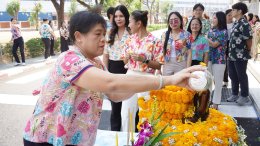 Management and employees of Thai Toshiba Lighting Co., Ltd. participated in a merit-making ceremony by offering alms to Buddhist monks and performing the traditional water-pouring ritual over a Buddha image in celebration of the Songkran Festival, seeking