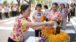 Management and employees of Thai Toshiba Lighting Co., Ltd. participated in a merit-making ceremony by offering alms to Buddhist monks and performing the traditional water-pouring ritual over a Buddha image in celebration of the Songkran Festival, seeking