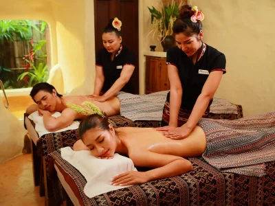 A couple enjoys a relaxing Honeymoon Package oil massage at Srimantra Spa Chiang Mai, with expert therapists providing meticulous care.