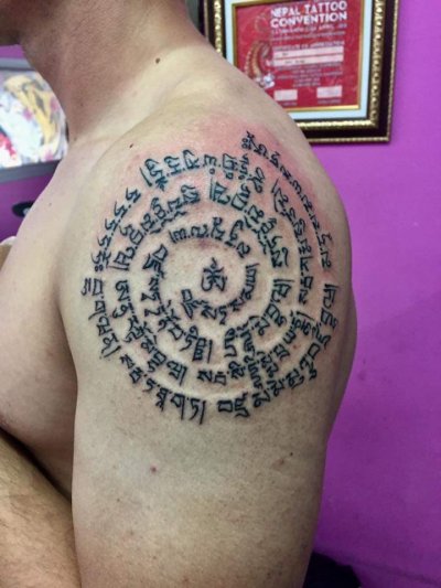 Thai traditional tattoo  sak yant by  bamboo technique 