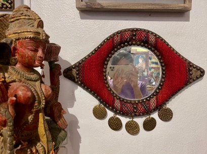 Round Mirror Eye Shape with Red Canvas Decor