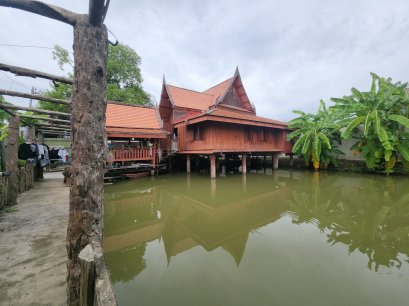Authentic Thai Teak House with Private Pond   A Hidden Oasis in Bang Kruai, Nonthaburi (Thanakorn Village 2) A rare plot in this area where you get not just land—but a fully built, move-in-ready traditional Thai house with a private pond.  167.4 sq. wah o