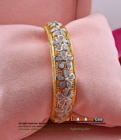กำไลทอง 96.5% น้ำหนัก 30.4 กรัมค่ะ (2 บาท) ฉลุลายดอกไม้ลงสีขาว สวยๆค่ะ