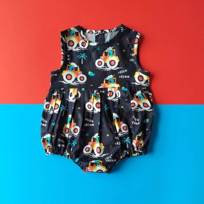 BUTTONS BACK DINO VROOM VROOM ROMPER BLACK 100% PRINTED COTTON