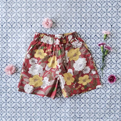 เด็กชาย-หญิง กางเกงเอวยางยืด มีกระเป๋าล้วงข้าง  100% คอตตอน ผ้าพิมพ์ลายดอกไม้นำโชค สีแดง *สินค้าแบบนี้มีที่งานออกบูทเอมควอเทีย 17-26 พฤศจิกายน