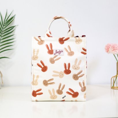 กระเป๋าใส่ไอแพด ลายกระต่ายหูยาวพื้นครีม