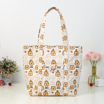 ช้อปปิ้งปะหน้า ผ้ากันน้ำพิมพ์ลาย Capybara ผลส้ม