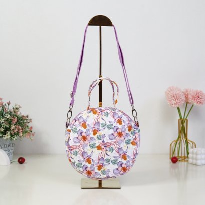 กระเป๋าวงกลม ผ้ากันน้ำลาย กล้วยไม้ม่วงครีม