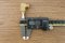 ข้อต่องอ 90° ทองเหลือง (เกลียวนอก x ตาไก่เสียบสาย) 1/4" x 4 mm