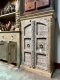 Distressed White Cabinet with Arch Doors