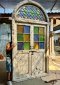 Colorful Arch Door with Colonial Carving