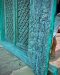 ประตูโบราณบานใหญ่สีฟ้าอมเขียวอ่อนแกะสลักลวดลายงดงาม