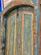 Blue Arched Door with Classic Paneling