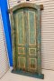 Blue Arched Door with Classic Paneling