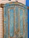 Blue Arched Door with Classic Paneling