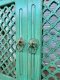 ประตูไม้ระแนงทรงโค้งมินิมอลสีเขียว