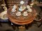 Round Dining Table with Brass Decor
