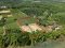 Rectangular plot, adjacent to roads on 3 sides, next to the river!! Beautiful and valuable — cheap sale! Vacant land in Tha Mai Ruak, Tha Yang, Phetchaburi, near Highway 3410. Ideal for building a resort, camping ground, riverside restaurant