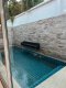 Great Value! Selling The Ville Jomtien Pool Villa resort property with tenants for immediate monthly rental income of 30,000 baht, totaling 360,000 baht per year, fully furnished. Urgent!