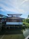 Here is the professional English translation of the real estate listing, optimized for international buyers and investors. Incredible Value! House in a Tourist Zone!! Canal-side House for Sale in Bang Kachao | Resort Feel | 5 Bedrooms | 32.7 Sq. Wah | 140