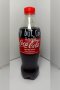 A bottle of Coca-Cola (Original taste Less sugar / A Thai label) 510 ml. which has My Slogan with My Signature
