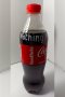 A bottle of Coca-Cola (Original taste Less sugar / A Thai label) 510 ml. which has My Slogan with My Signature