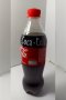 A bottle of Coca-Cola (Original taste Less sugar / A Thai label) 510 ml. which has My Slogan with My Signature