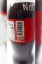 A bottle of Coca-Cola (Original taste Less sugar / A Thai label) 510 ml. which has My Slogan with My Signature
