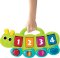 INFANTINO เปียโนตัวหนอน เสริมสร้างกล้ามเนื้อและความจำ Light 'n Sound Pop Up Buddy (12m+)