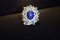 "Tanusorn Natural Star Sapphire 22 carat Ring Adorned with Blue Topaz Gemstone"