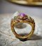 A golden ruby fang ring