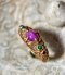 A golden ruby fang ring
