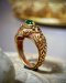 A golden emerald fang ring