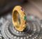 Nopphakao "Phirot" Ring accented with Emeralds and Rubies
